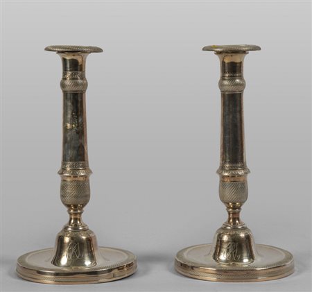 Coppia  di candelieri in argento<br>h.cm.21