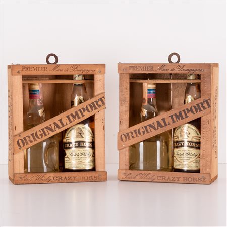  
Lotto di 2 confezioni contenenti whisky e Grappa 
 