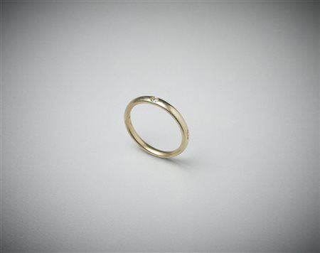  POMELLATO - Fedina Lucciole con un diamante taglio brillante. 0,03 carati. .