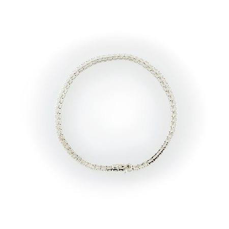 Bracciale tennis in oro bianco 18 kt e diamanti taglio brillante. 