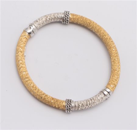 BRACCIALE IN ORO In oro bianco e giallo, realizzato come un cerchio rigido...