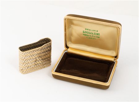 FODERA PER ACCENDINO In oro bianco e giallo, modellato seguendo una trama ad...