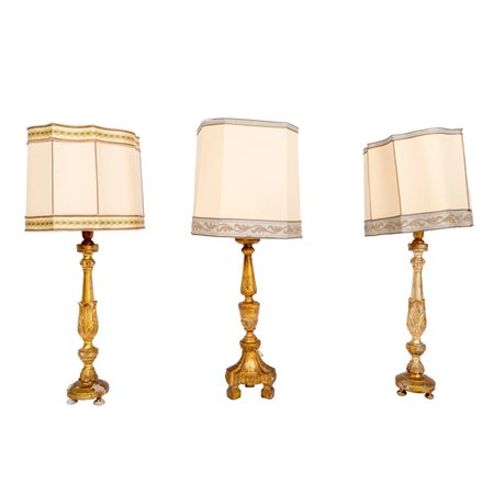 TRE CANDELABRI in legno dorato