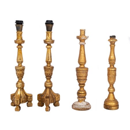 QUATTRO CANDELIERI in legno dorato