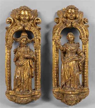 Santi, coppia di sculture in legno finemente 