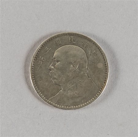 Moneta cinese in argento<br>diam.cm.3,9