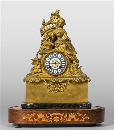 Orologio in bronzo dorato raffigurante giovane 