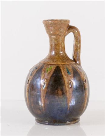 PIETRO MELANDRI (Faenza 1885 – 1976) Piccola brocca in ceramica smaltata in...