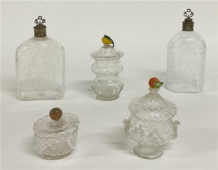 Lotto composto da due bottiglie in vetro molato con chiusure in metallo argenta