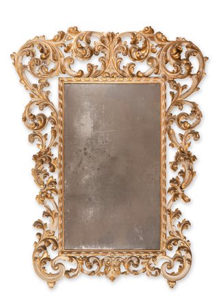    Grande specchiera riccamente intagliata, laccata e dorata, Emilia, fine XVIII- inizi XIX secolo 
