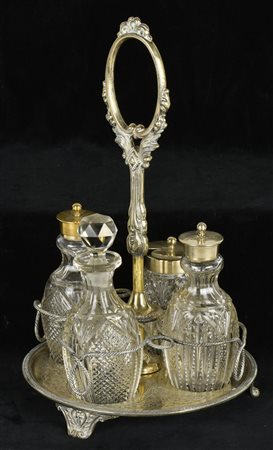 ACETOLIERA in metallo argentato con ampolle in cristallo Germania, fine XIX...