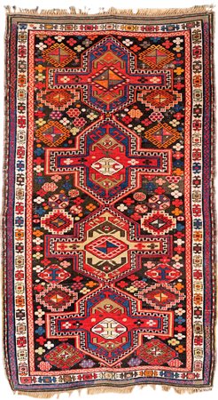 Tappeto caucasico, metà del XIX secolo con colori vivaci nei toni dominanti...