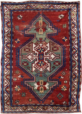 Tappeto anatolico fondo rosso, fine XIX/inizi XX secolo centrato da un grande...