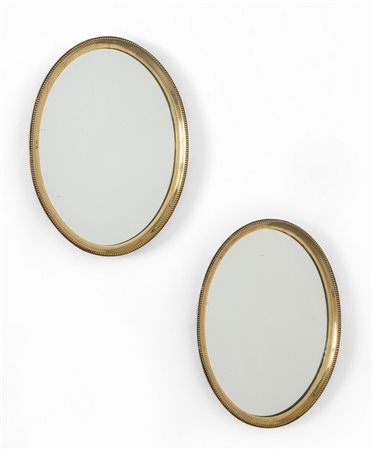 UNA COPPIA DI SPECCHI, anni '50. <br>Ottone, 