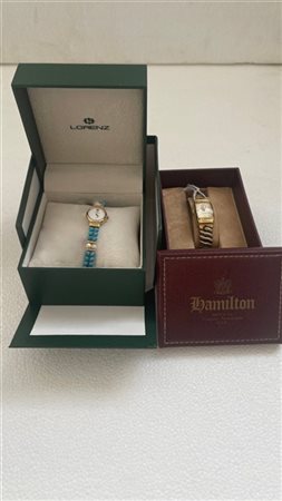 Lotto composto da due Orologi in metallo dorato (Hamilton e Lorenz) di forme e