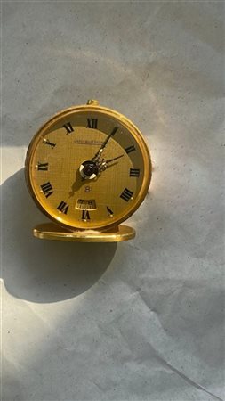 Jaeger LeCoultre, Orologio da viaggio con cassa in ottone dorato di forma roton