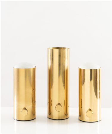 BOTTEGA GADDA (Attribuito) Tre lampade da tavolo in metallo dorato. Prod....