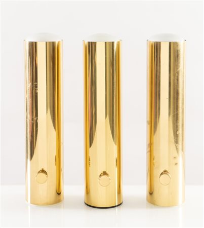 BOTTEGA GADDA (Attribuito) Tre lampade da tavolo in metallo dorato. Prod....