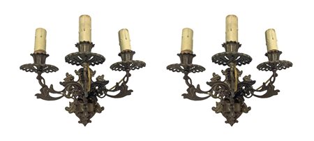 Coppia di appliques in bronzo dorato a tre luci