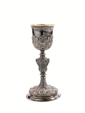 Calice, sec. XVIII, in argento, fusto con nodo piriforme decorato da volute,...