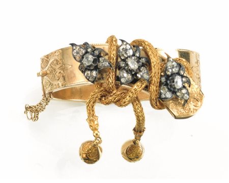 Bracciale, sec. XIX, in oro giallo, argento e diamantia cerchio rigido,...