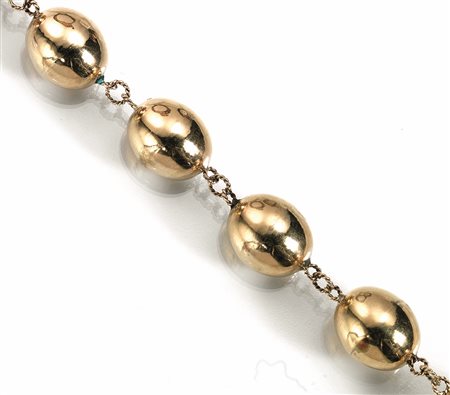 Collana in oro giallorealizzata ad una fila di diciassette sfere ovali in oro...