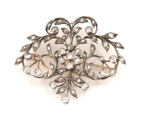 Spilla, fine sec. XIX, in argento, oro e diamantimodellata come un tralcio a...