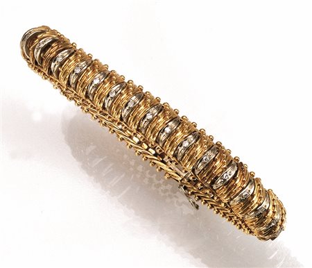 Bracciale in oro giallo, oro bianco e diamantimontatura flessibile a sezione...