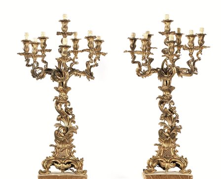 Coppia di flambeaux, fine sec. XIX, in bronzo dorato, a nove luci, su basi di...