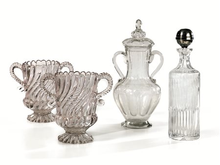 Due rinfrescatoi, sec. XIX, in vetro, anse a torciglione terminante a...