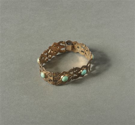  Arte del Nord America  - Navajo, Messico. 
Bracciale in 7 pezzi in argento dorato e turchesi. 
.