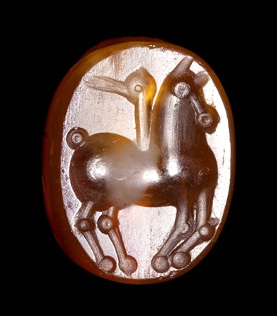 AN ETRUSCAN CARNELIAN SCARAB. HORSE. 