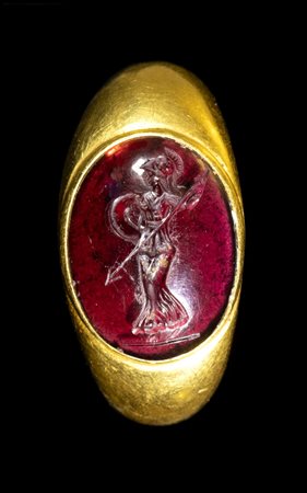 A GREEK LATE HELLENISTIC GARNET INTAGLIO SET IN A GOLD RING. ATHENA. 