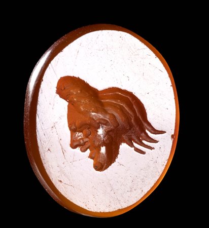 AN ITALIC CARNELIAN INTAGLIO. THEATRICAL MASK. 