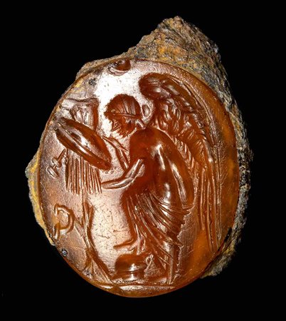 A ROMAN CARNELIAN INTAGLIO. NIKE WITH A TROPHY.
