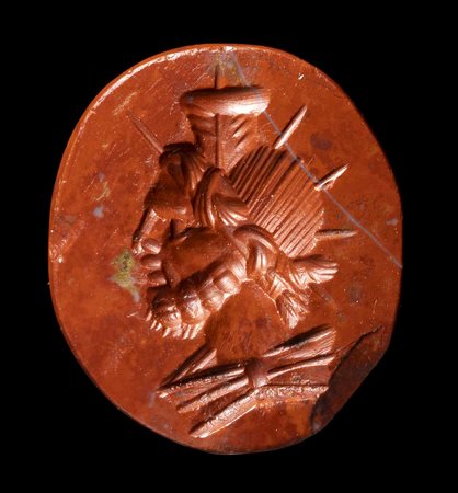 A ROMAN RED JASPER INTAGLIO. BUST OF ZEUS SERAPIS.