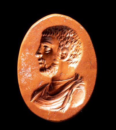 A ROMAN RED JASPER INTAGLIO. BUST OF A BEARDED MAN. 