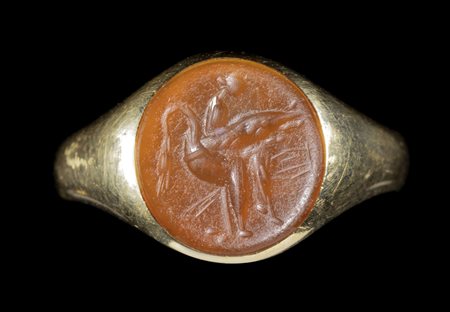 A ROMAN CARNELIAN INTAGLIO SET IN A GOLD RING. LEDA ON THE SWAN.