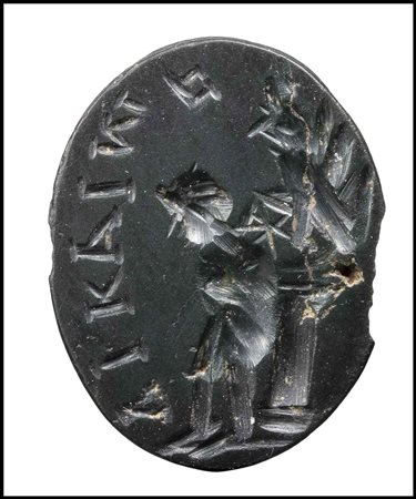 A ROMAN MAGICAL DARK GREEN JASPER INTAGLIO. EROS TIED TO A COLUMN WITH INSCRIPTION. 