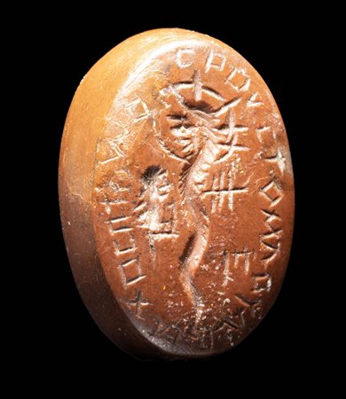 A ROMAN GNOSTIC ORANGE JASPER INTAGLIO. CHNOUBIS WITH GREEK INSCRIPTION.