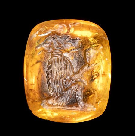  A FINE ROMAN MAGICAL CITRINE INTAGLIO. SEATED DOUBLE-HEADED BABOON WITH INSCRIPTION. 