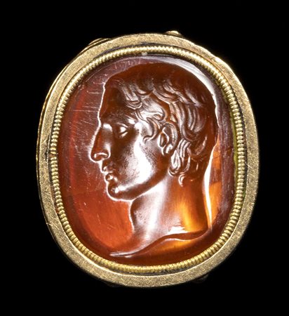 A FINE CARNELIAN INTAGLIO SET IN A GOLD FOB SEAL. MALE PORTRAIT. 