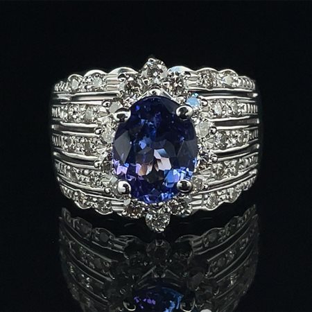 ANELLO IN ORO 14K 9,47 GRAMMI TAGLIA 8 – PIETRA CENTRALE TANZANITE 2 CT E 34...