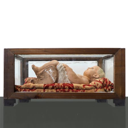 Bambinello in ceramica policroma di Caltagirone, in teca .