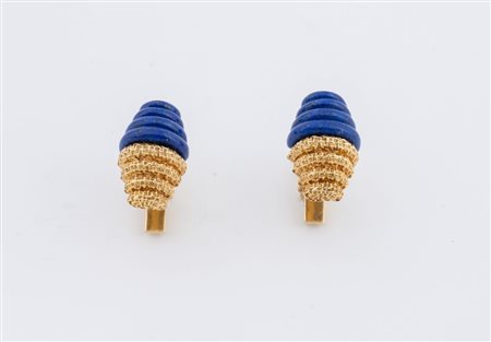 Paio di gemelli in oro giallo 18K, ciascuno realizzato con elemento oblungo...