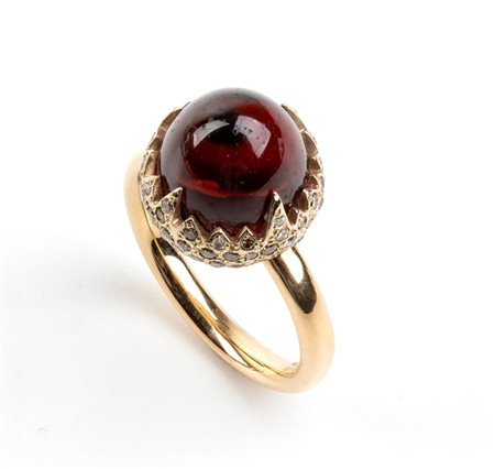 POMELLATO: anello "chimera" in oro con granato e diamanti brown 