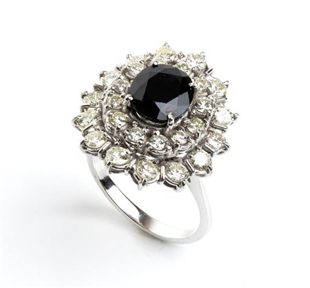 Anello in oro bianco con zaffiro e diamanti