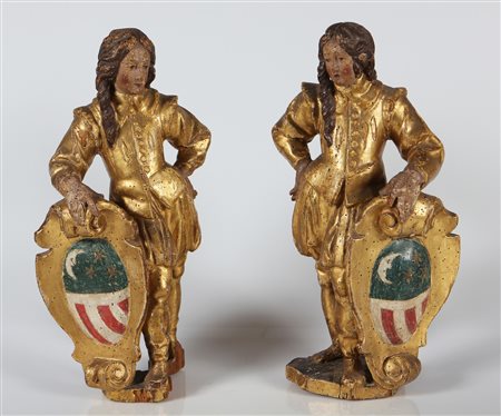 MANIFATTURA LOMBARDA DEL XVII SECOLO Coppia di paggi che sorreggono stemmi...