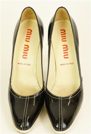 Miu Miu PUMPS Description: Black and white patent leather pumps. Heel of 11...
