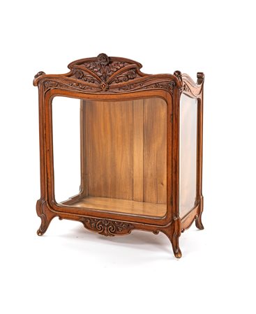 Teca in legno e vetro contenente una stella cometa in metallo